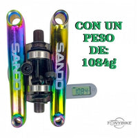 Juego de bielas SANDO de TONYBIKESGDL con acabado tornasol, eje de 19 mm y peso de 1084 gramos sobre báscula digital.