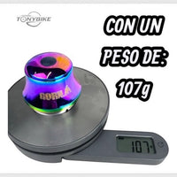 Juego de dirección integrada Gorila de TONYBIKESGDL con acabado tornasol sobre una báscula digital marcando 107 gramos.