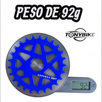 Plato azul TONYBIKESGDL AeroBMX de 25 dientes sobre una báscula digital mostrando un peso de 92 gramos