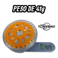 Plato dorado de 25 dientes para bicicleta BMX de TONYBIKESGDL fabricado en aluminio ultraligero sobre una báscula