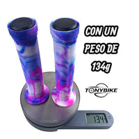 Puños TONYBIKESGDL para bicicleta con diseño marmoleado azul, rosa y blanco, textura ergonómica y tapones negros.
