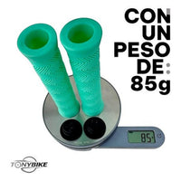 Puños TONYBIKESGDL para bicicleta en color verde menta con patrón antideslizante en zigzag y tapones, pesando 85 gramos.