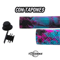 Puños de silicona TONYBIKESGDL con patrón geométrico multicolor azul, rosa y negro, incluyen tapones para manubrio.