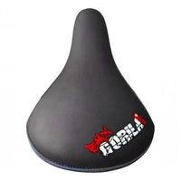 Sillín BMX TONYBIKESGDL negro mate con borde iridiscente y logo BMX GORILLA, diseño ergonómico resistente.