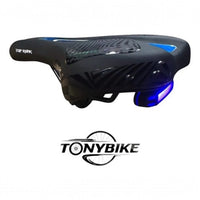 Sillín ergonómico TONYBIKESGDL negro con detalles azules, apertura central y luz trasera LED de seguridad integrada.